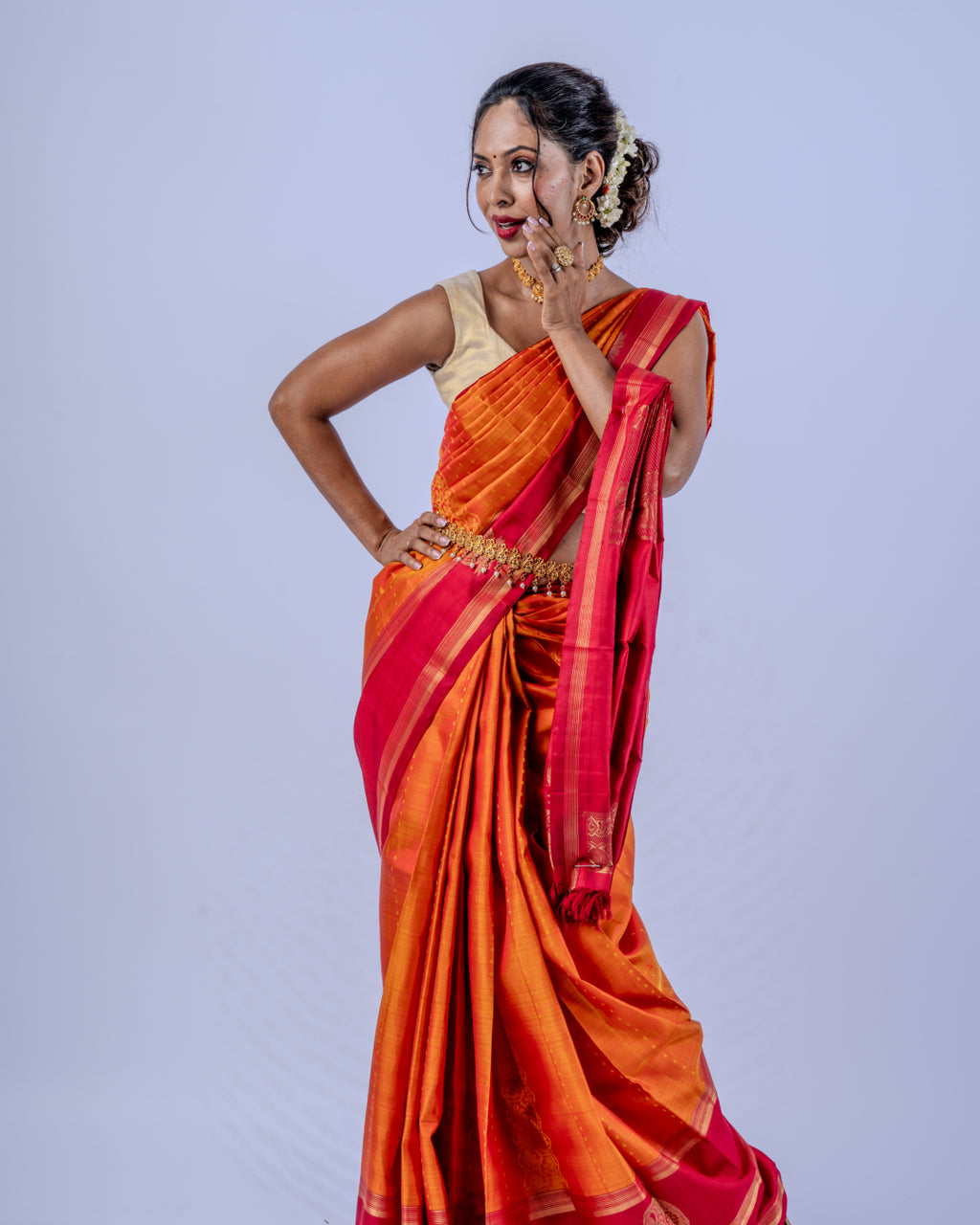 Orange woven pure zari Kanjeevaram saree