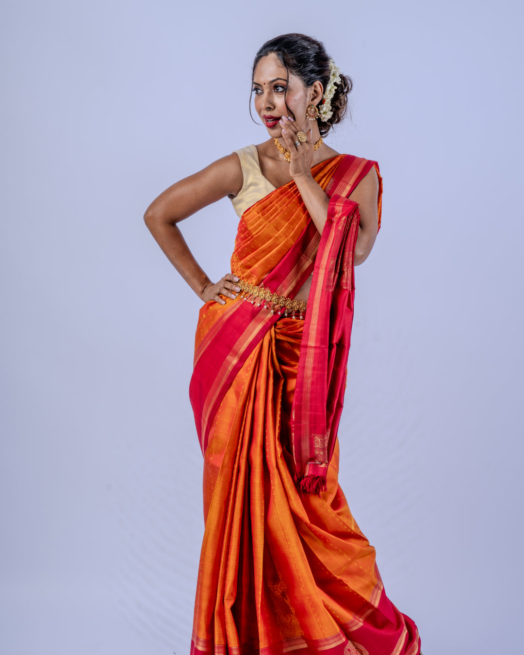 Orange woven pure zari Kanjeevaram saree