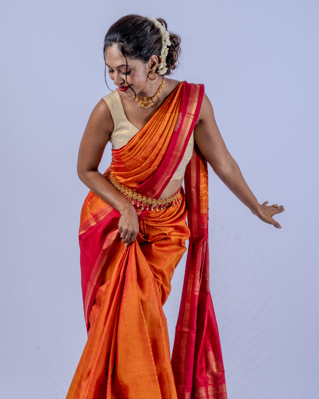 Orange woven pure zari Kanjeevaram saree